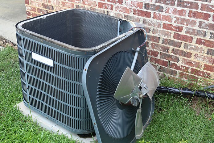 Fan blade laying against HVAC unit