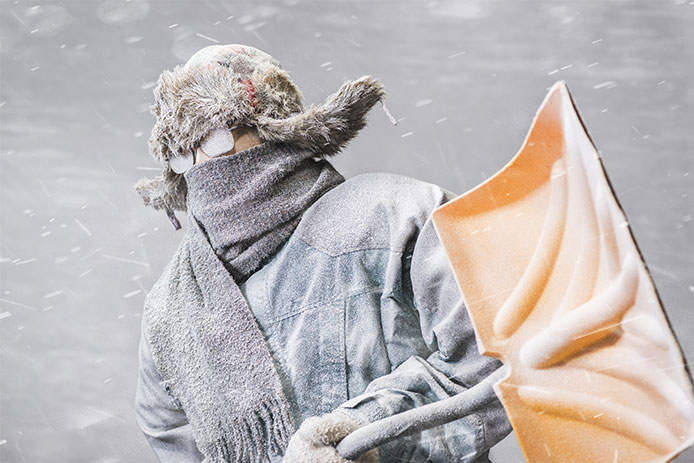 Man holding a snow shovel