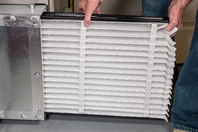 Replacing the air filter to the HVAC